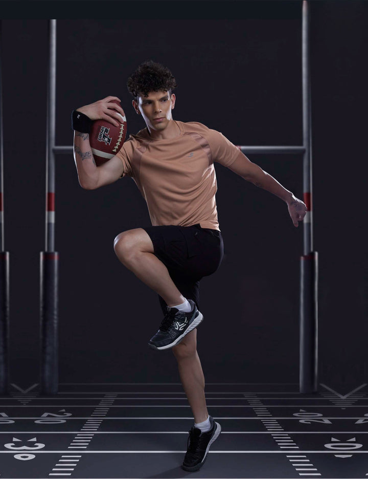 Sportzfit Men's Dot-Mesh Raglan Tee in Peach – full-length action pose