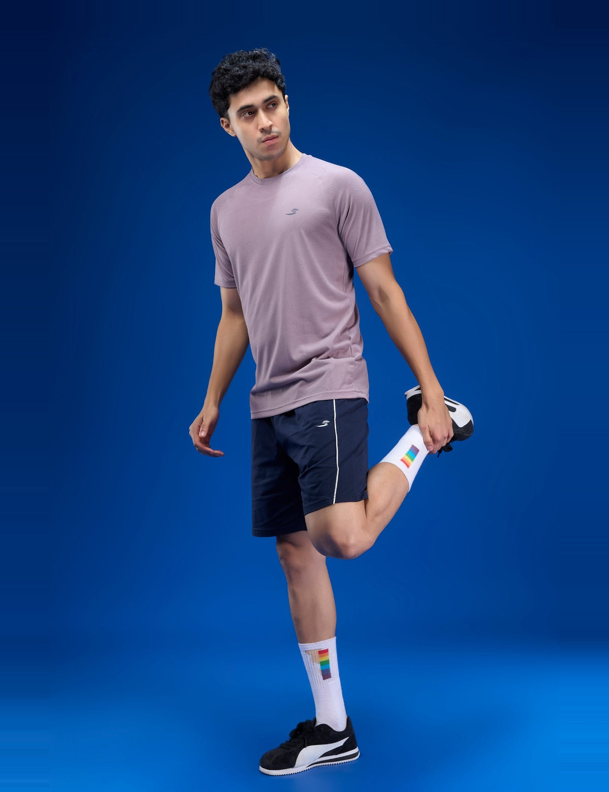 Sportzfit Men's Geo-Mesh Tee in Mauve – stretching pose